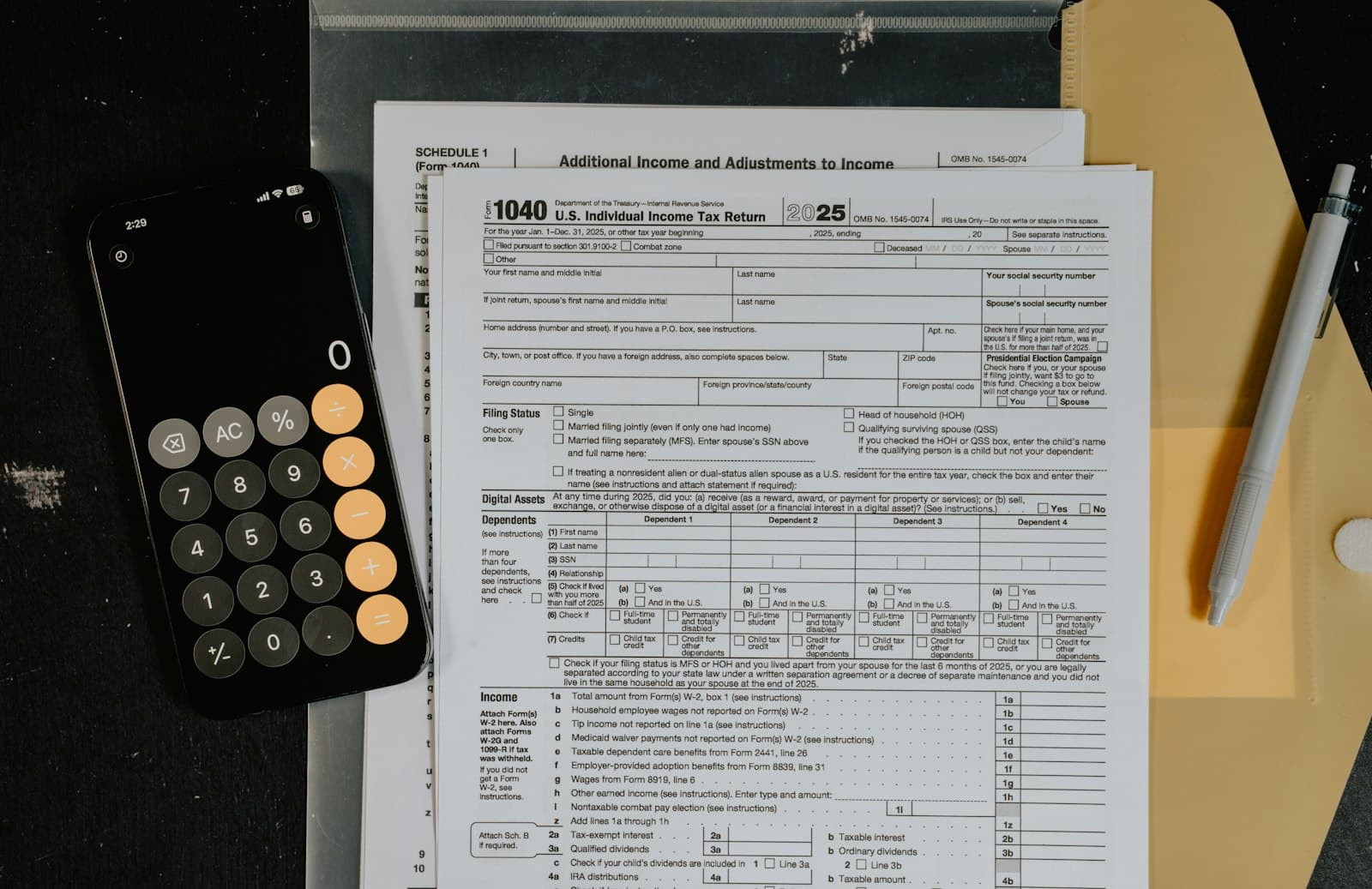 Tax forms and calculator on a desk